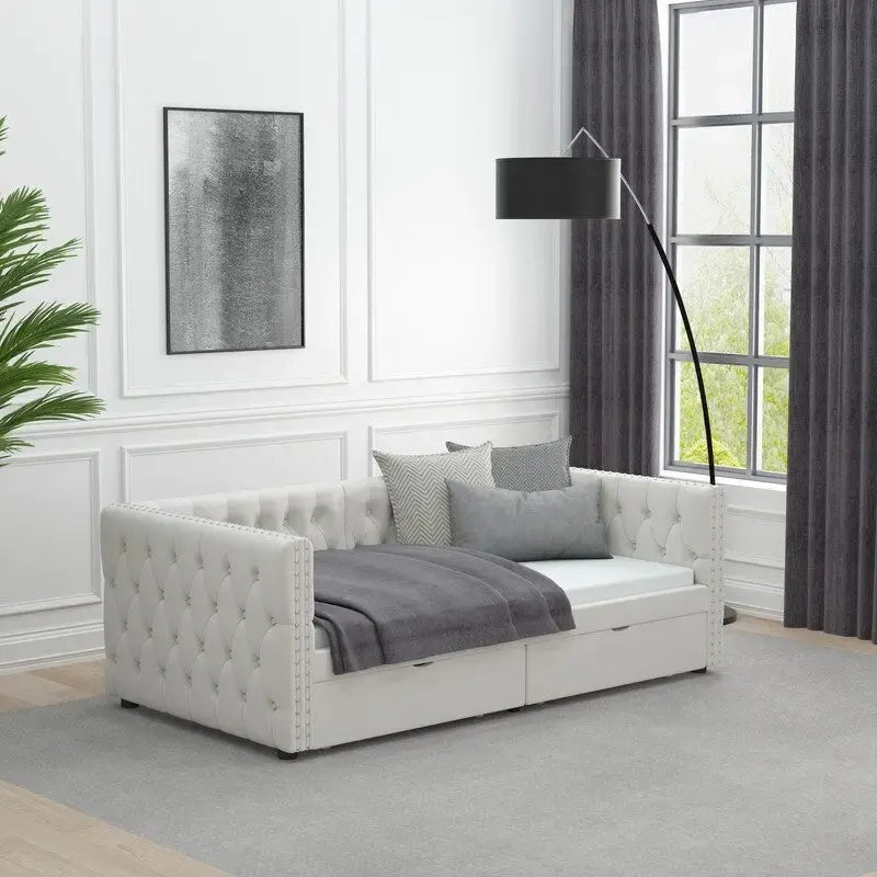 Lit de repos capitonné avec tiroirs, boutons et clous de cuivre