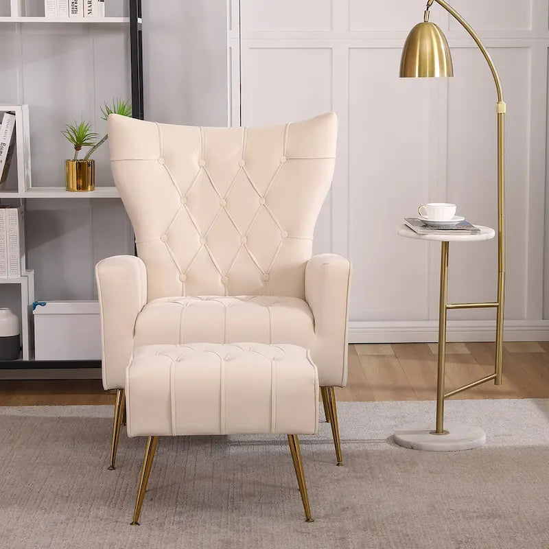 Fauteuil à oreilles tapissé avec pouf