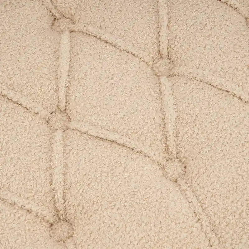 Fauteuil à oreilles tapissé avec pouf