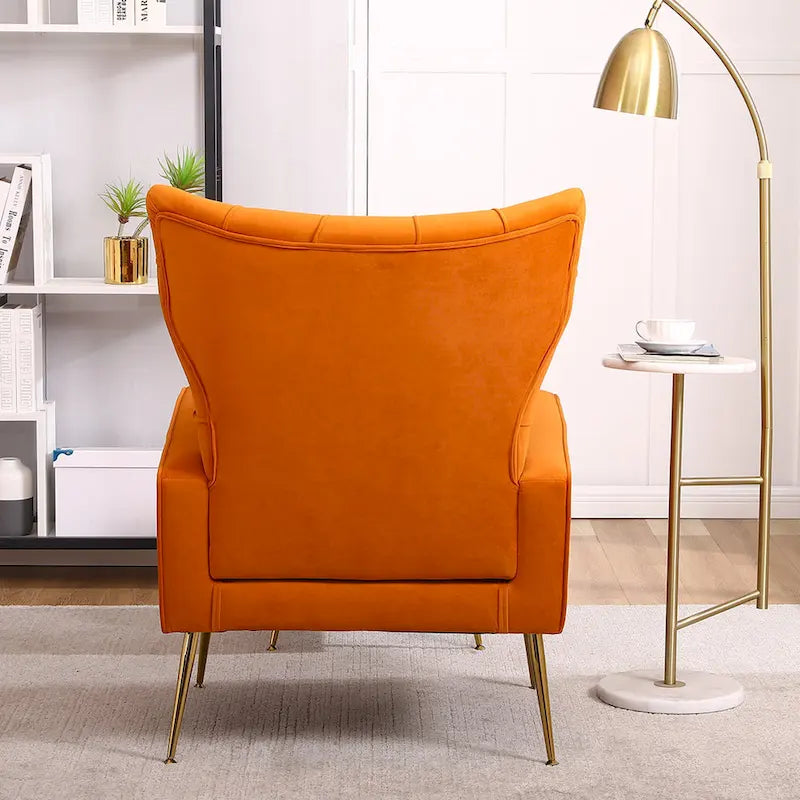 Fauteuil à oreilles tapissé avec pouf